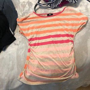 Short Sleeve T shirt with orange, pink, and beige stripes. Lacy back